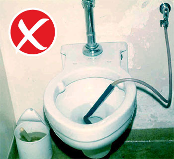 Toilet with pipe going into it